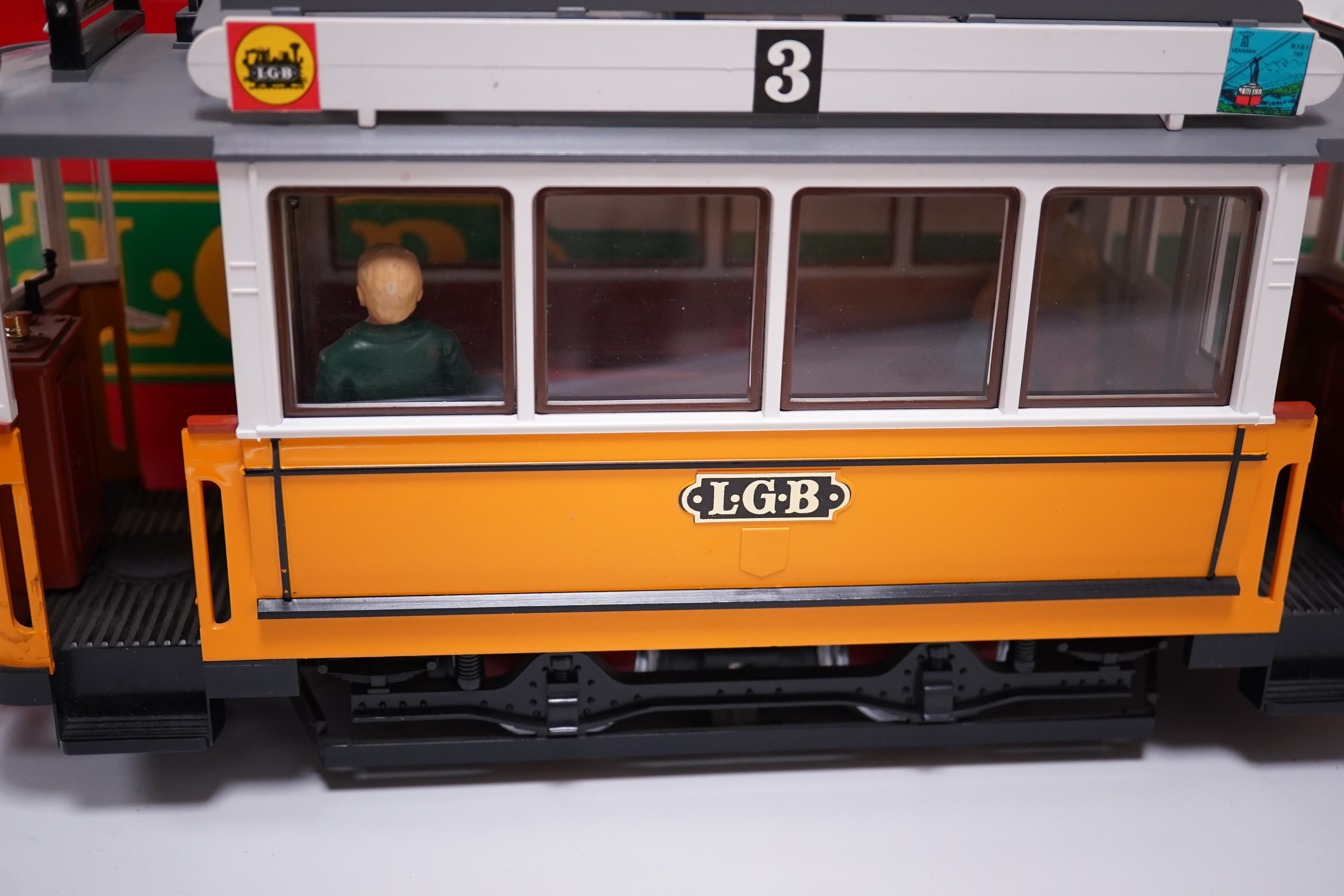 Two boxed G scale pantograph electric tramcars; a Bachmann Big Haulers tram in Hershey’s livery and a Lehmann LGB tram. Condition - fair to good.